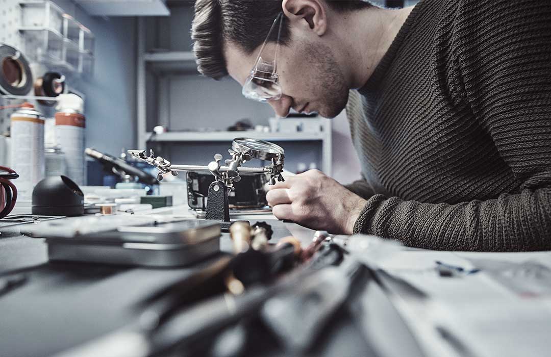 Young man working in the service center